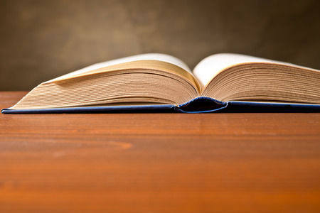 a open book on the brown tablleの写真素材