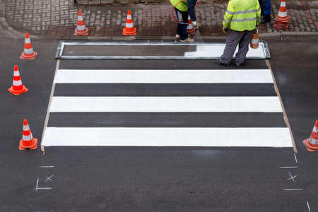 making of a new pedestrian crossing on the roadの写真素材