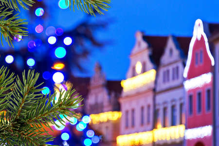 buildings with christmas decoration and christmas treeの写真素材