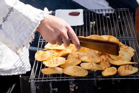 detail of roastet cheese in the street standの写真素材