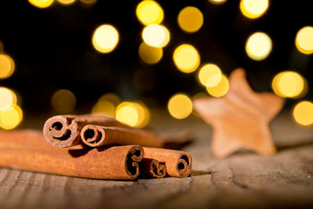 Christmas background with cinnamon and christmas starの写真素材
