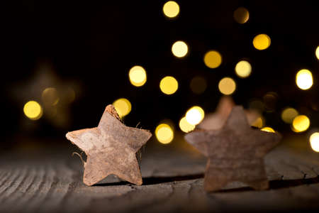 Christmas background with cinnamon and christmas starの写真素材