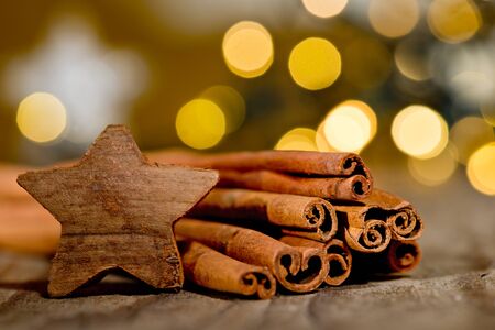 Christmas background with cinnamon and christmas starの写真素材