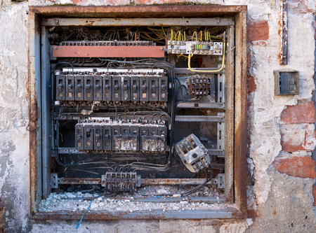 a detail of old broken circuit breakersの写真素材