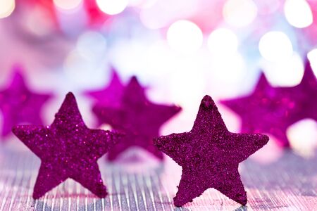 Christmas background with stars and colored glitterの写真素材