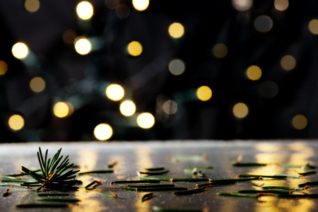 Christmas background with needles and color llights