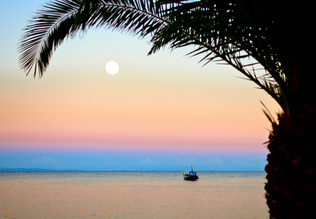 Sunset and Moonrise in Zakynthos, Greeceの写真素材