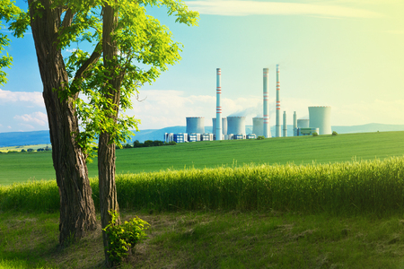 landscape with a tree and power stationの写真素材