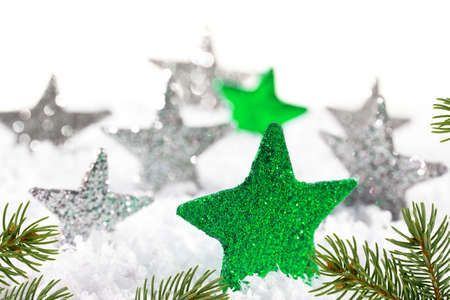 Christmas background with green stars and christmas twigの写真素材