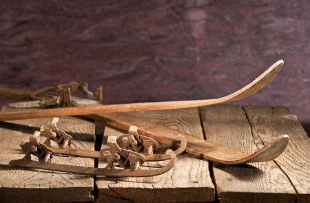 old skies and skates on the wooden tableの写真素材