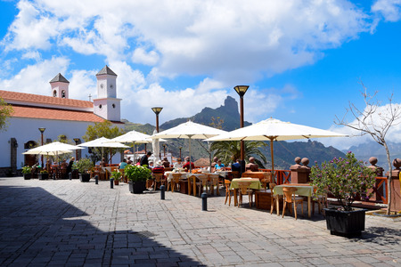 GRAN CANARIA, SPAIN - MARCH 20, 2017: Outdoor restaurant in front of the Church of Nuestra Senora del Socorro in Tejeda.のeditorial素材