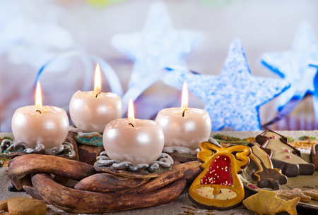 Advent Wreath with Burning Candles on the Tableの写真素材