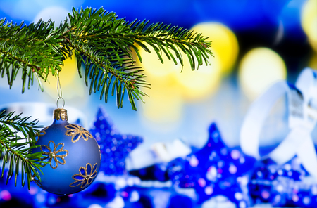 Blue Christmas Ball with Christmas Twig on the Blue Backgroundの写真素材