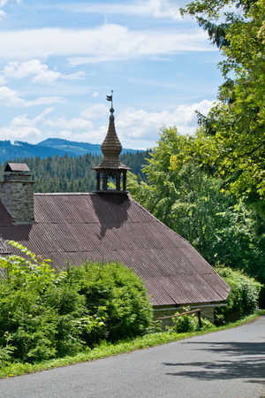A house with smal tower in the Bohemian Forest. Czech Republic.の写真素材