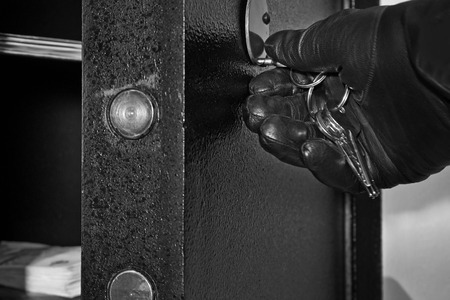 Detail of Open Safe with Hand of Thiefの写真素材