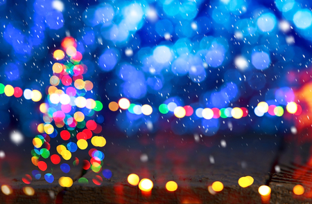 Christmas background. Christmas tree in the snow fall.の写真素材