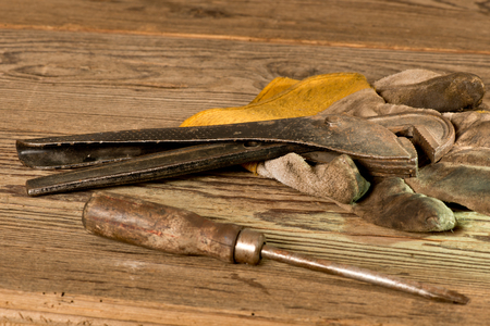 still life with adjustable spanner and glovesの写真素材