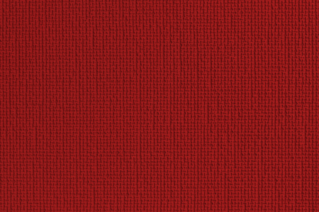Red  background. Detail of a red wallの写真素材