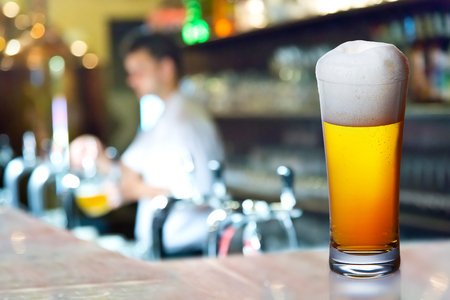 Glass of beer in the pubの写真素材
