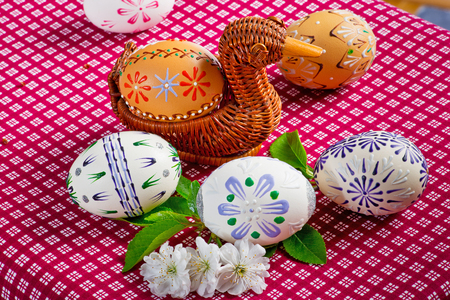 Easter eggs on the red tableclothの写真素材