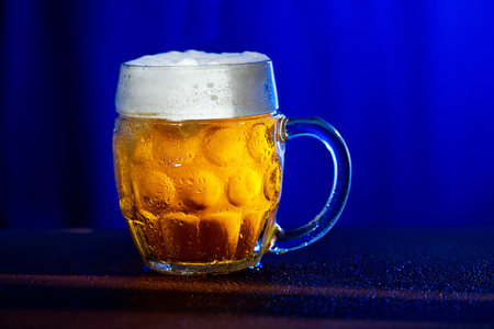 Glass of beer with drops of waterの写真素材