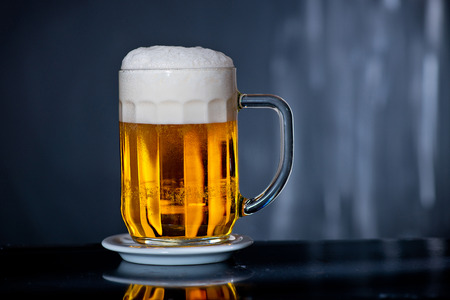 Glass of beer with drops of waterの写真素材