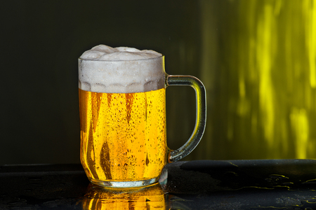 Glass of beer with drops of waterの写真素材