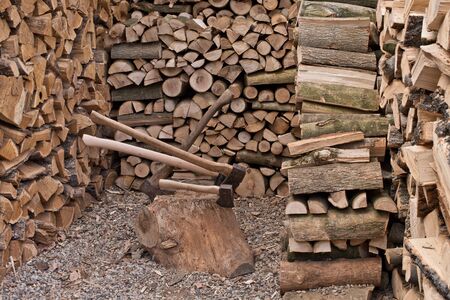 A old axe with fire woodの写真素材