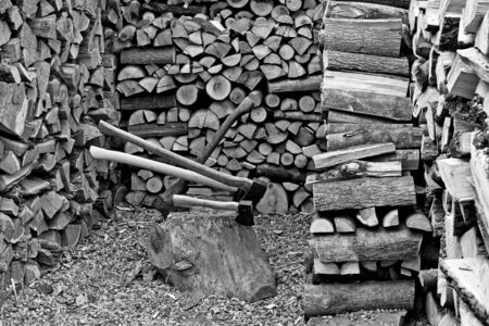 A old axe with fire woodの写真素材
