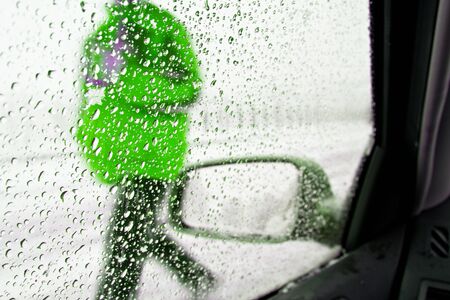 Detail of rear-view mirror in the rainy weatherの写真素材