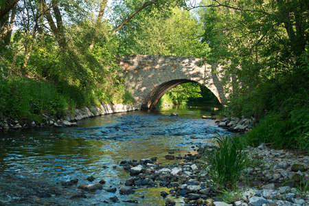 Old stone bridge in the summerの写真素材