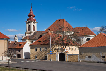 Baroque Church and presbytery in town of Postoloprty. Czech Republic.の写真素材