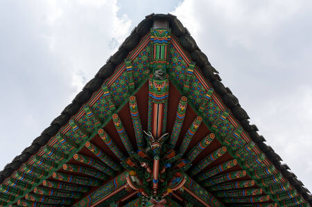 Traditional temple roof corner with a blue sky  Taken in Baegyangsa, South Korea