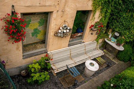 Bruges back garden and bench taken in Bruges, Belgiumの写真素材