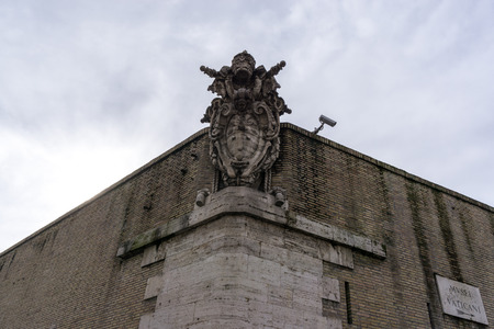 Statue in Vatican city wall over looking the cross roadの写真素材