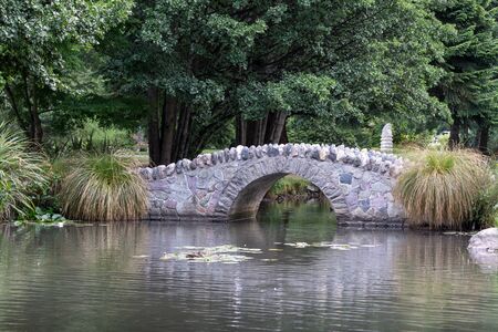 a small rock bridge in queenstown gardens in new zealand.の写真素材