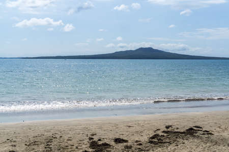 narrow neck beach view with rangitoto island in the distance. Taken in Auckland, New Zealandの写真素材