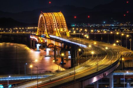 banghwa bridge with expressways over the han river taken at night. Long exposure view. Seoul, South Korea.の写真素材