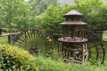 gallery of watermills in front of huanglong cave entrance area in zhangjiajie, chinaの写真素材