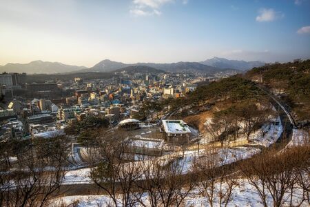 view of the seoul city and winding road in naksan park covered in snow. Taken in Seoul, South Korea