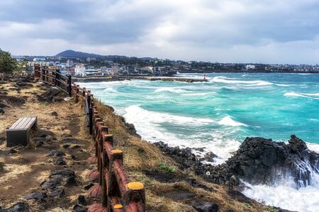 hagwe-aewall coastal road view with waves hitting the coast side. Jeju Island, South Koreaの写真素材