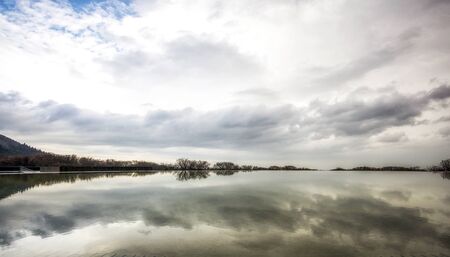 reflections on a small fountain on top of jeju stone park museum in jeju island, south koreaの写真素材