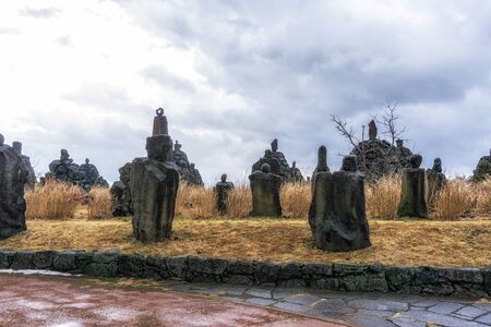 bangsataps among the tall grasses in jeju stone park in south koreaの写真素材