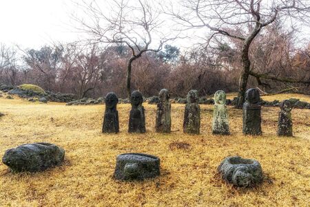dongjaseok, child looking grave stone, in jeju stone park, south koreaの写真素材