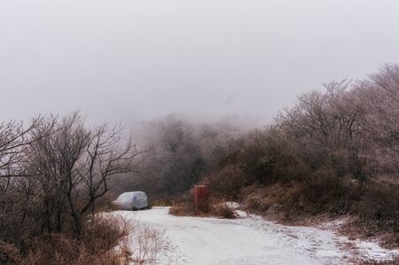 Snow covered frozen landscape along the Jiri Mountain trail. Taken amidst a snow storm. Near the...