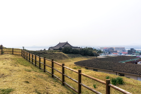 dong am sa temple viewed from seongsan ilchulbong park in jeju island, south koreaの写真素材