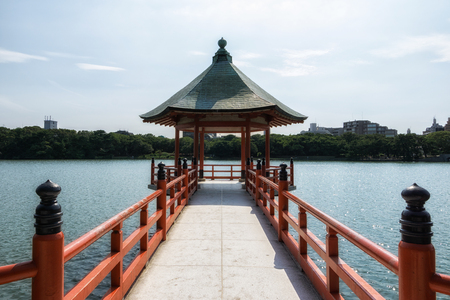 ohori park vermilion pavilion in one of the many islands in the middle of the large pond. Taken in Fukuoka, Japanの写真素材