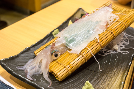 plate of live ika squid sashimi taken in a restaurant in fukuoka, japanの写真素材