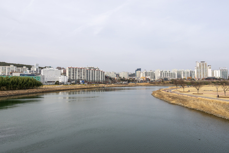 Taehwa river with the surrounding apartment buildings nearby. Taken in Taehwagang park in Ulsan, South Korea. Taken on February 15th 2019のeditorial素材