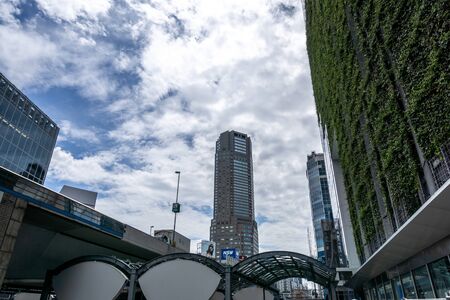 view of tall skyscraper buildings from streets of shibuya, tokyo, japan. Taken on June 28th 2019のeditorial素材